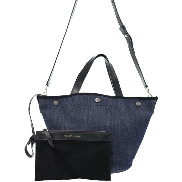 Prada Handbags - Prada denim bucket bag blue denim body black leather trim